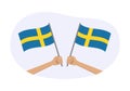 Sweden waving flag icon or badge. Hand holding Swedish flags. Vector illustration.